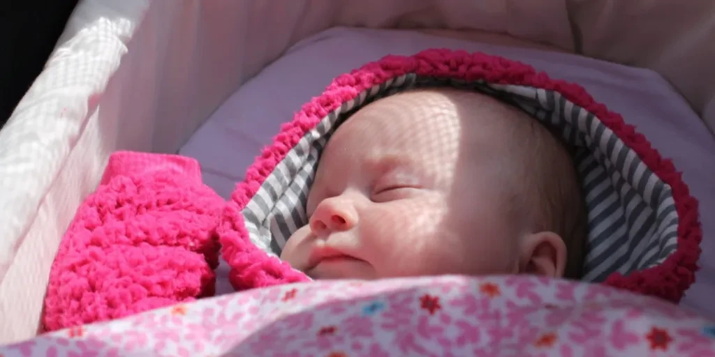 Baby sleeping in a bassinet