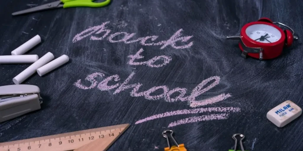back to school written on a board with stationery
